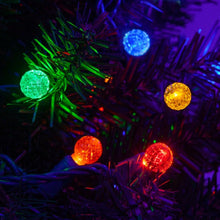 Load image into Gallery viewer, multicolored G12 faceted lights installed in a tree
