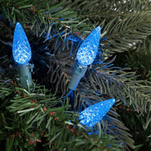 Load image into Gallery viewer, blue faceted christmas lights installed in a tree

