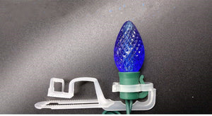 omni clip attached to a faceted blue bulb