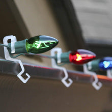 Load image into Gallery viewer, omni clip attached to filament bulbs on roofline
