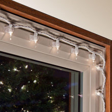 Load image into Gallery viewer, adhesive clip attached on a window sill with christmas bulbs 
