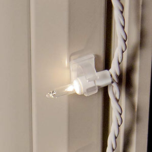 adhesive clip attached on a corner window sill